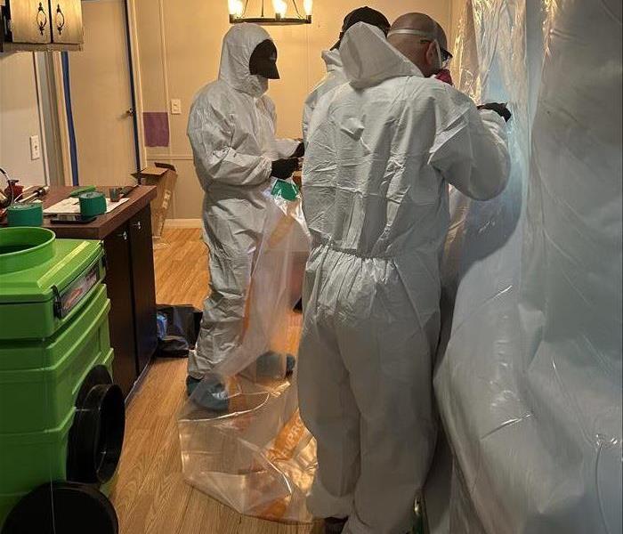 SERVPRO team in proper PPE performing mold remediation 